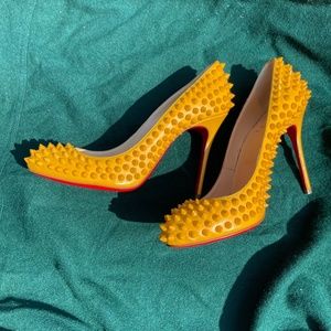 GORGEOUS yellow spiked Louboutins. Excellent condition!! Purchase via Real Real
